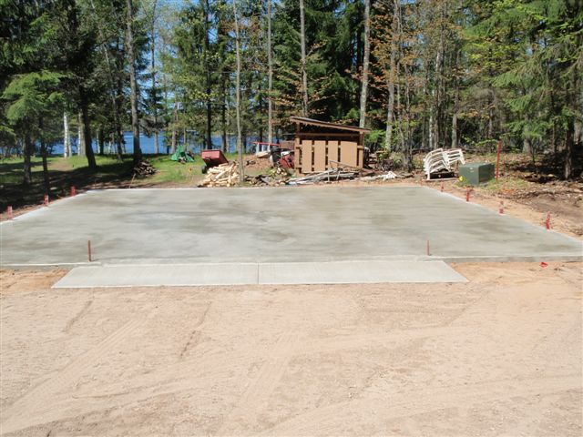 This is a 4" thick slab with our normal 12" x 12" grade beam reinforced with reinforcing rod.